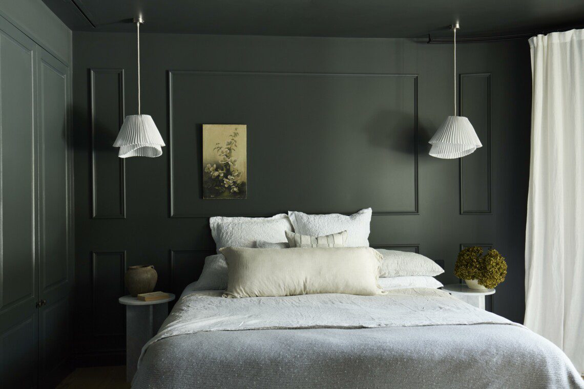 accommodation with green wall and a king size bed