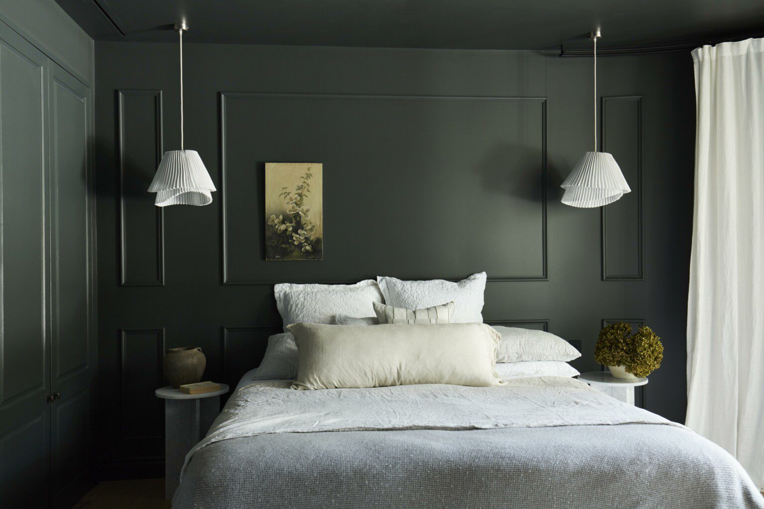 accommodation with green wall and a king size bed